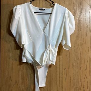 Mind Code white bodysuit with belt and puff shoulders